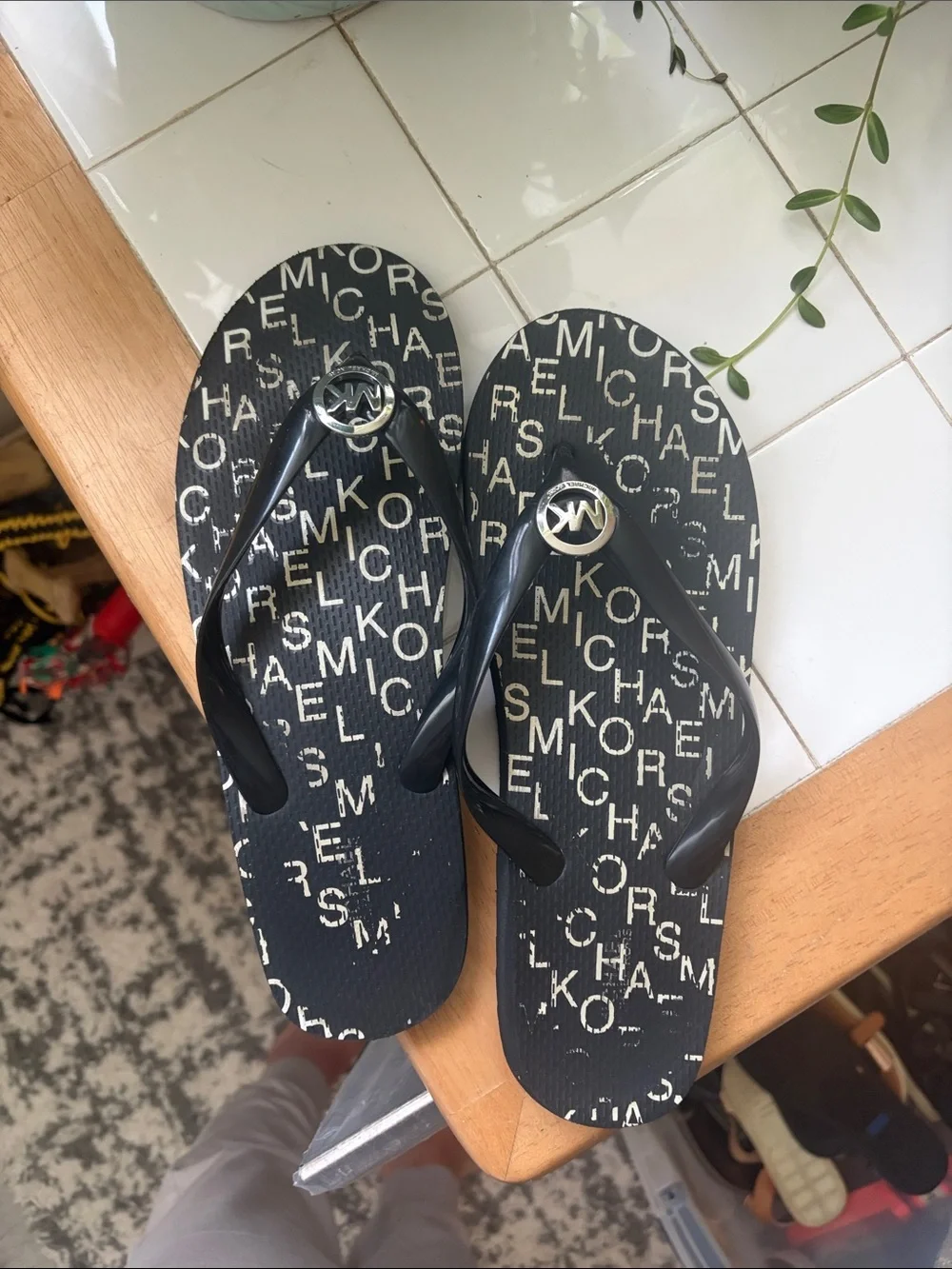 Michael Kors Black Logo Print Girls' Flip Flops with Silver MK Medallion